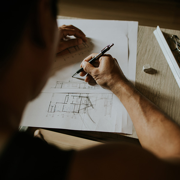 Architect drawing a building design
